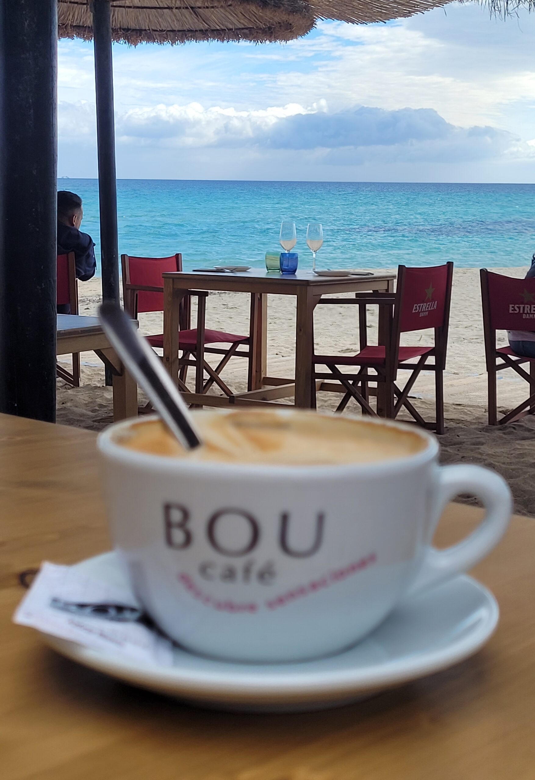 a cup of coffee at a beach bar enhances your travel experiences!